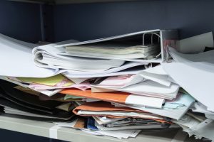 Messy file document and Office Supplies in filing cabinets at wo